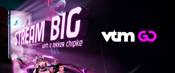 Colorful promotional image for VTM GO streaming service featuring "STREAM BIG" text, animated characters including a dinosaur, and the VTM GO logo against a purple-lit background.